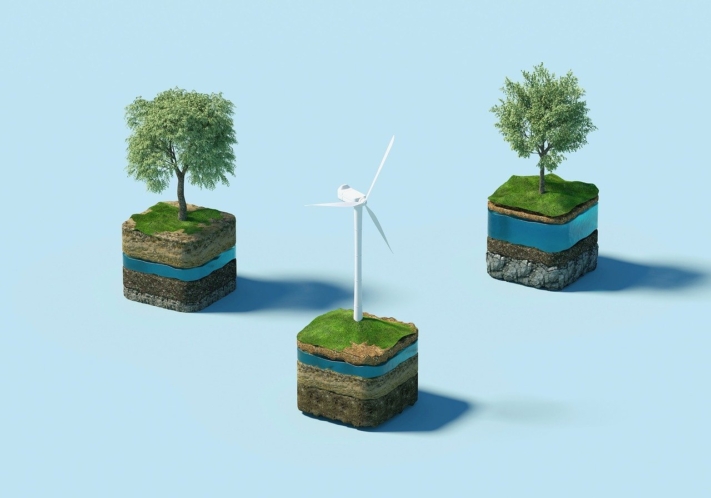CSR: Two trees and a wind turbine on three cubes.